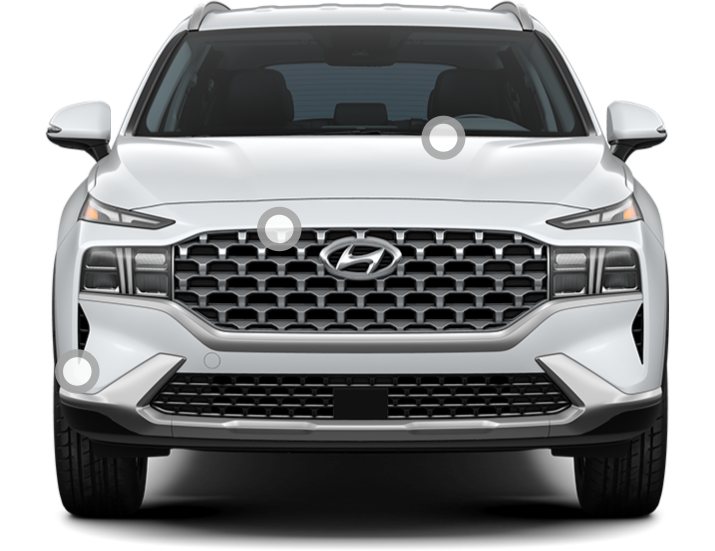 Front view of a white Hyundai Santa Fe.
